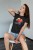 t-shirt-mockup-of-a-long-haired-woman-sitting-on-a-modern-chair-4290-el1 (Copy).jpg